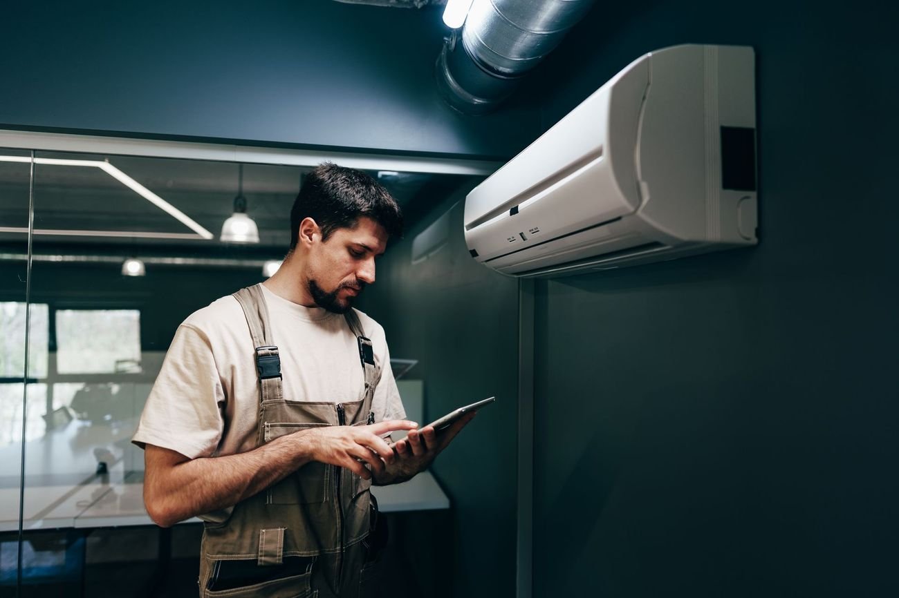J&J technician running HVAC system diagnostics